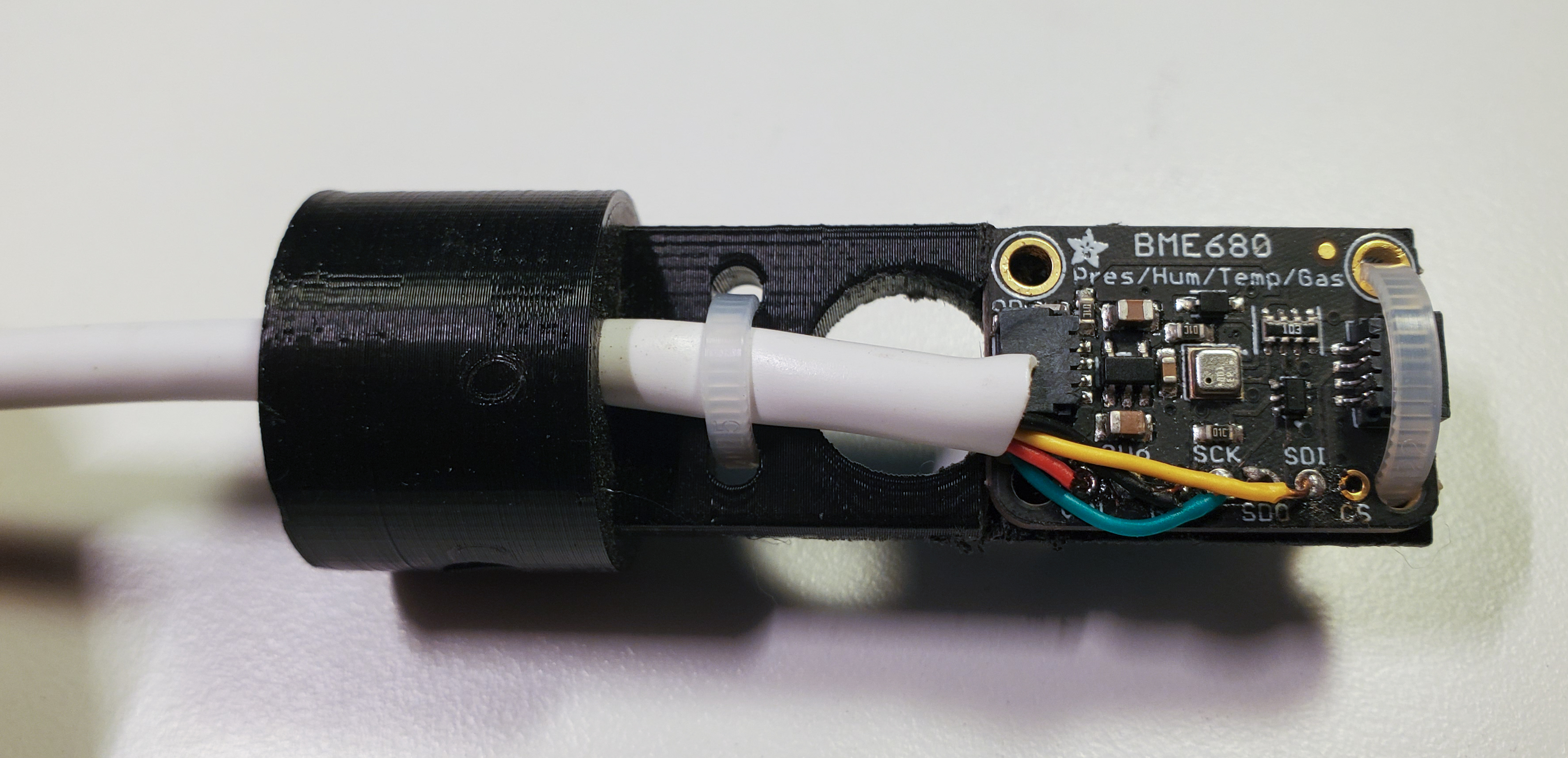 BME680 Sensor breakout board mounted to 3D printed caddy for insertion in radiation shield